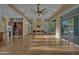 Bright and airy living room with hardwood floors, fireplace, and access to the backyard at 5891 S Cobblestone Dr, Chandler, AZ 85249