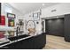 Modern kitchen with dark cabinetry and granite countertops at 6184 N 28Th Pl, Phoenix, AZ 85016