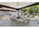 Outdoor patio with dining table and built-in grill, overlooking the pool at 6184 N 28Th Pl, Phoenix, AZ 85016