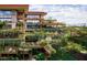 Modern condo building with lush landscaping and multiple levels at 7157 E Rancho Vista Dr # 5006, Scottsdale, AZ 85251