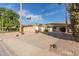 Single-level home with a two-car garage and a landscaped front yard at 7517 N Via Del Elemental --, Scottsdale, AZ 85258