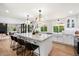 Updated kitchen with white cabinets, marble countertops, and a farmhouse sink at 8607 N Farview Dr, Scottsdale, AZ 85258