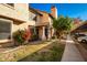 Inviting exterior of a two-story townhome with landscaping and parking at 921 W University Dr # 1136, Mesa, AZ 85201