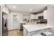 Modern kitchen with white cabinets and stainless steel appliances at 921 W University Dr # 1136, Mesa, AZ 85201