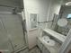 Clean bathroom with granite vanity, shower stall and medicine cabinet at 9501 E Broadway Rd # 107, Mesa, AZ 85208