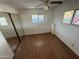 Bright bedroom with wood-look floors and ample natural light at 9501 E Broadway Rd # 107, Mesa, AZ 85208