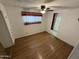 Spacious bedroom with ceiling fan and large window at 9501 E Broadway Rd # 107, Mesa, AZ 85208