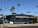 Mobile home with carport and palm trees at 9501 E Broadway Rd # 107, Mesa, AZ 85208