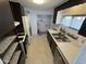Kitchen with stainless steel sink and appliances at 9501 E Broadway Rd # 107, Mesa, AZ 85208