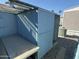 Blue metal storage shed with a side door at 9501 E Broadway Rd # 107, Mesa, AZ 85208