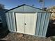 Blue metal storage shed with white double doors at 9501 E Broadway Rd # 107, Mesa, AZ 85208