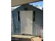 Exterior storage shed with white door and windows at 9501 E Broadway Rd # 107, Mesa, AZ 85208