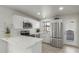 Modern kitchen with white cabinets, stainless steel appliances, and quartz countertops at 9514 W Baden St, Tolleson, AZ 85353