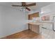 Small dining area adjacent to kitchen with wood floors at 100 N Vulture Mine Rd # 101, Wickenburg, AZ 85390