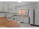 Galley kitchen with wood countertops and appliances at 100 N Vulture Mine Rd # 101, Wickenburg, AZ 85390