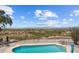 Community pool with scenic mountain views and seating areas at 100 N Vulture Mine Rd # 101, Wickenburg, AZ 85390