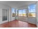 Bright sunroom with tiled floors and sliding glass doors to backyard at 100 N Vulture Mine Rd # 101, Wickenburg, AZ 85390