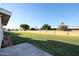 Backyard with grassy lawn and patio at 10620 W Clair Dr, Sun City, AZ 85351