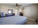 Comfortable bedroom with a double bed and ceiling fan at 10620 W Clair Dr, Sun City, AZ 85351