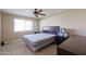 Spacious bedroom with a double bed and ceiling fan at 10620 W Clair Dr, Sun City, AZ 85351