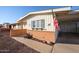 Side view of a ranch-style home with brick accents at 10620 W Clair Dr, Sun City, AZ 85351