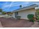 Covered patio, gravel yard, and sliding glass door access from the house at 10934 E Becker Ln, Scottsdale, AZ 85259