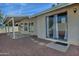 House backyard with patio cover and sliding glass doors at 10934 E Becker Ln, Scottsdale, AZ 85259