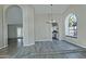 Dining area with wood-look floors and arched window at 10934 E Becker Ln, Scottsdale, AZ 85259