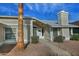 House entrance with white door and walkway at 10934 E Becker Ln, Scottsdale, AZ 85259