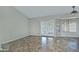 Living room with tile floors and sliding glass doors to backyard at 10934 E Becker Ln, Scottsdale, AZ 85259