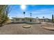 Ranch-style home with landscaped yard and gravel at 11022 W Boswell Blvd, Sun City, AZ 85373