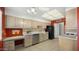 Kitchen with light wood cabinets, stainless steel appliances, and tile flooring at 11022 W Boswell Blvd, Sun City, AZ 85373