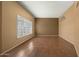 Spacious living room with hardwood floors and large windows at 11022 W Boswell Blvd, Sun City, AZ 85373