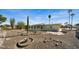 Landscaped backyard with gravel, rock garden, and cactus at 11022 W Boswell Blvd, Sun City, AZ 85373