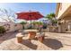 Outdoor kitchen and patio area with seating at 11122 N 165Th Ave, Surprise, AZ 85388