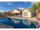 Home exterior showcasing a private pool and expansive backyard at 11122 N 165Th Ave, Surprise, AZ 85388