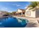 Spacious backyard with a refreshing pool and ample patio space at 11122 N 165Th Ave, Surprise, AZ 85388