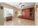 Bedroom with built-in murphy bed and wood shelving at 11122 N 165Th Ave, Surprise, AZ 85388