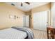 Comfortable bedroom with ceiling fan and double door closet at 11122 N 165Th Ave, Surprise, AZ 85388