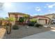 Single-story home with a two-car garage and well-maintained landscaping at 11122 N 165Th Ave, Surprise, AZ 85388