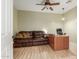 Home office featuring a leather couch and a wood desk at 11122 N 165Th Ave, Surprise, AZ 85388