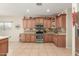 Well-equipped kitchen with granite countertops and range at 11122 N 165Th Ave, Surprise, AZ 85388