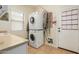 Stackable washer and dryer in a bright laundry room at 11122 N 165Th Ave, Surprise, AZ 85388