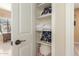 Well-organized linen closet with shelves and folded towels at 11122 N 165Th Ave, Surprise, AZ 85388