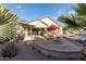 Outdoor patio with fire pit, built-in BBQ, and ample seating at 11122 N 165Th Ave, Surprise, AZ 85388