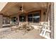 Covered patio with seating area and ceiling fan at 11122 N 165Th Ave, Surprise, AZ 85388