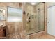 Spacious walk-in shower with tiled walls and built-in seat at 11122 N 165Th Ave, Surprise, AZ 85388