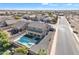 House with a pool and spa in a residential neighborhood at 11506 E Sylvan Ave, Mesa, AZ 85212