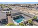 Aerial view showing a two story house with a pool in the backyard at 11506 E Sylvan Ave, Mesa, AZ 85212