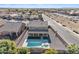 Aerial view of two story house with pool and backyard at 11506 E Sylvan Ave, Mesa, AZ 85212